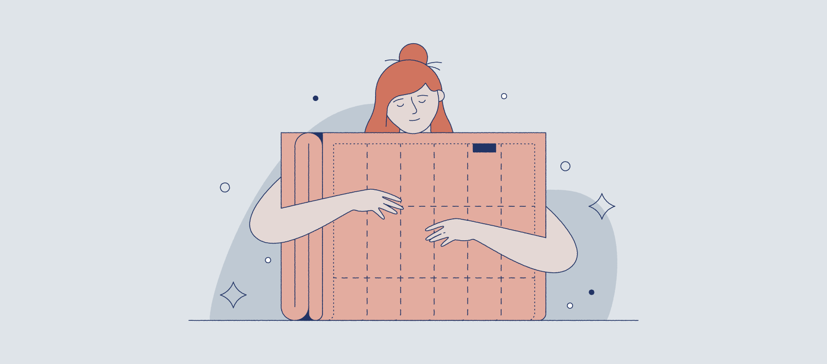 woman with red hair hugging a weighted blanket