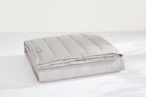 Folded white weighted blanket
