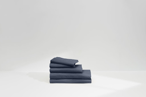 A stack of folded bed sheets